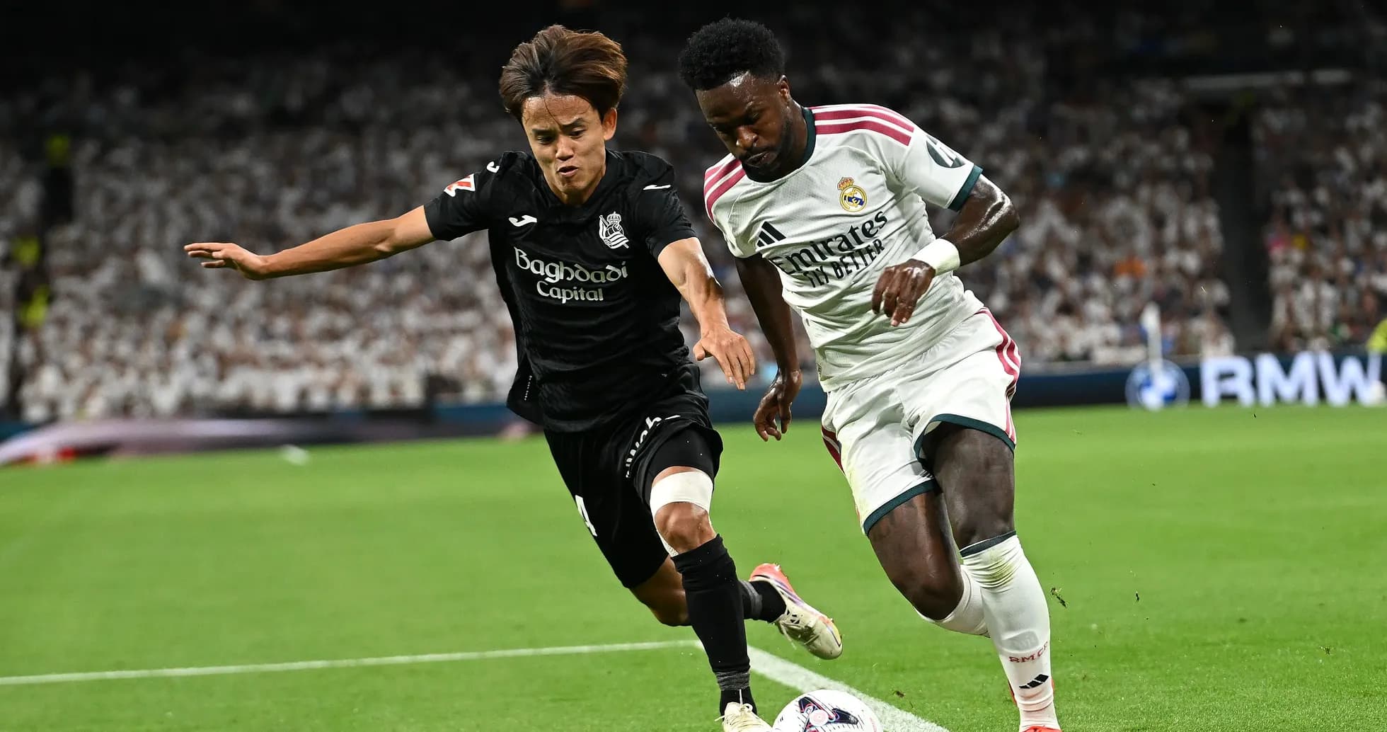 Two players contesting the ball during a match Two players contesting the ball during a match