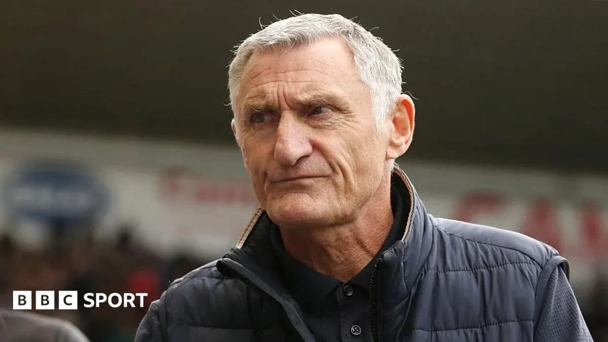 Manager looking focused during a match Manager looking focused during a match