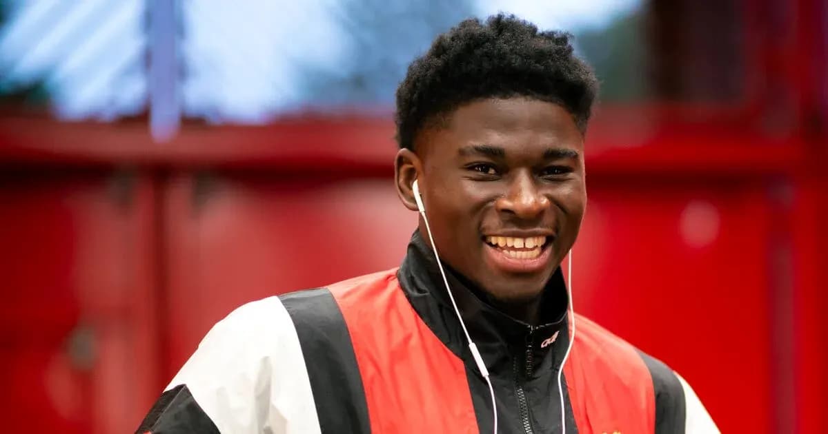 Young athlete smiling while wearing headphones Young athlete smiling while wearing headphones
