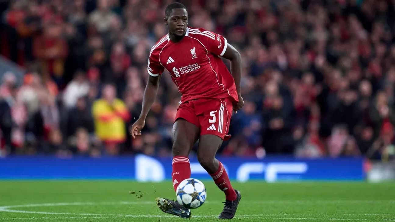 Liverpool player dribbling the ball on field Liverpool player dribbling the ball on field