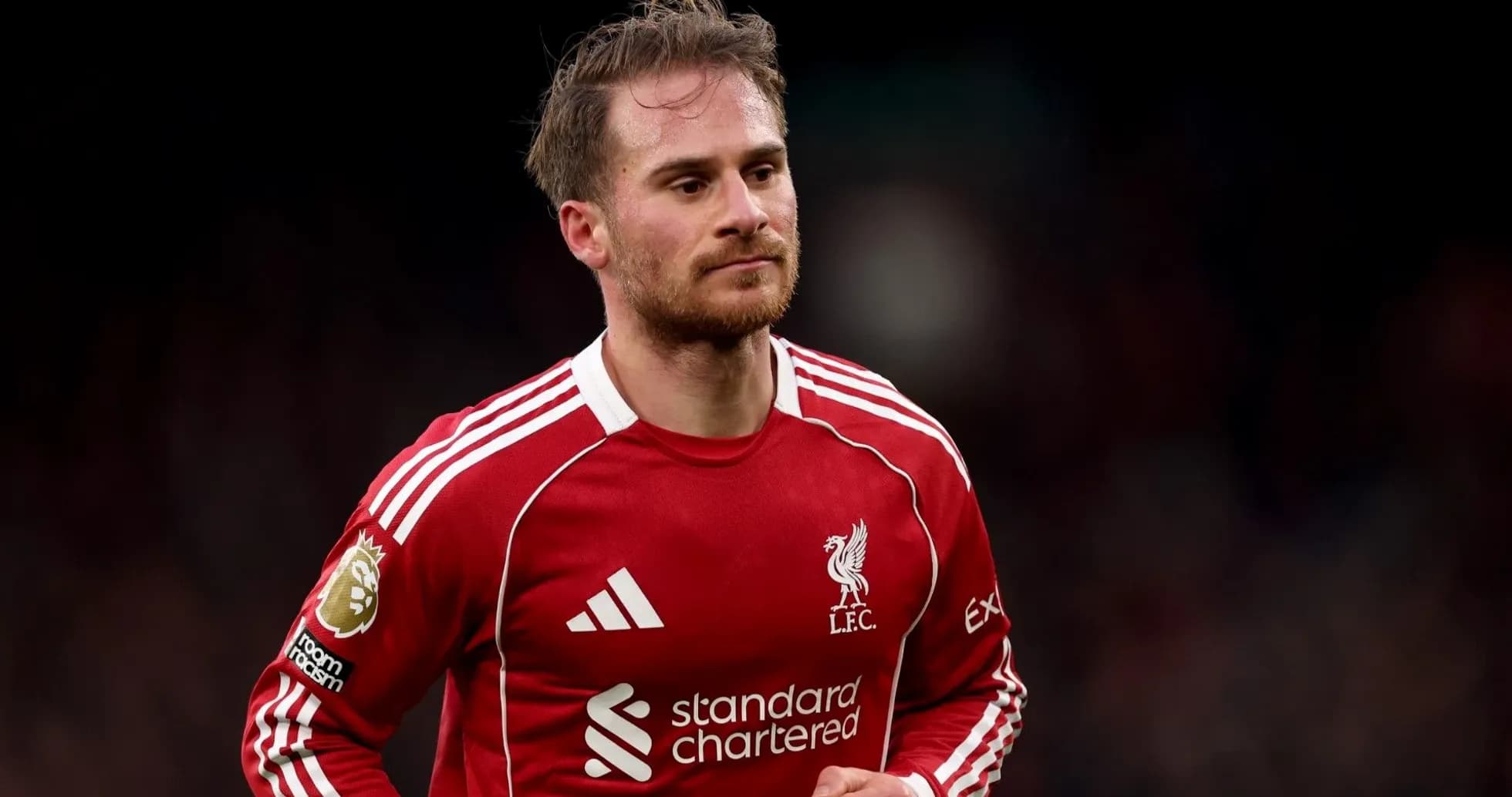 Player wearing Liverpool FC kit on the pitch Player wearing Liverpool FC kit on the pitch
