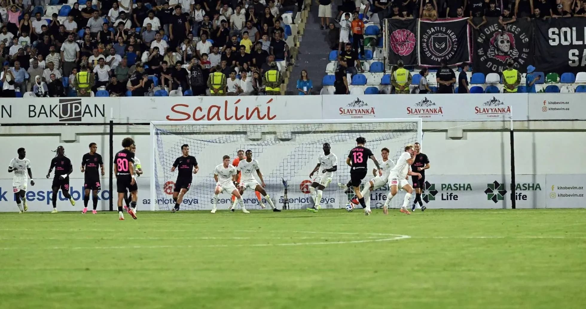 KuPS players defending against Sabah FA attack KuPS players defending against Sabah FA attack