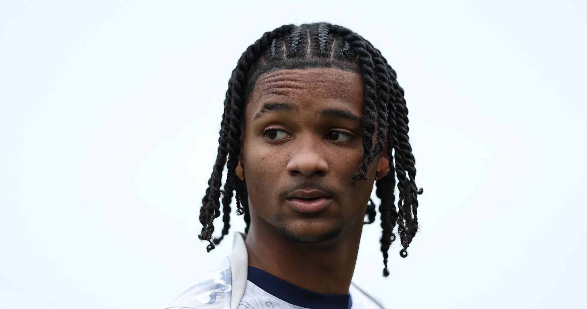 Player with braided hair looking away from camera Player with braided hair looking away from camera