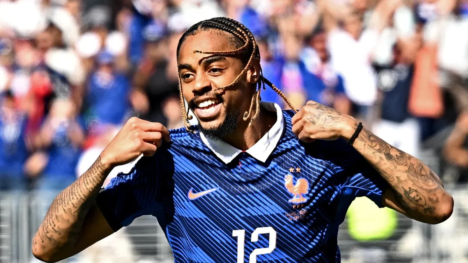 Player celebrating with France jersey after scoring Player celebrating with France jersey after scoring