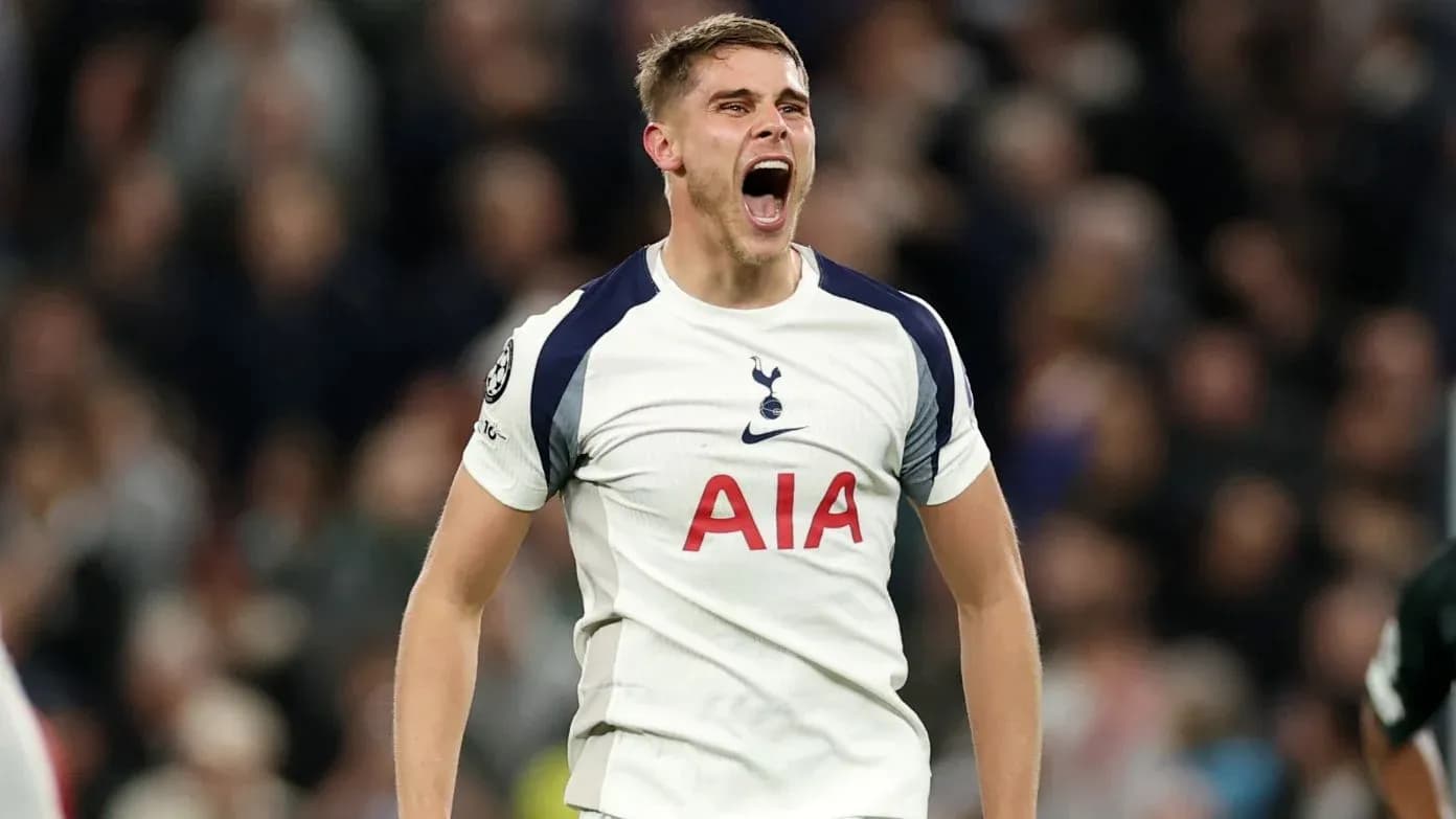 Player celebrating during a Champions League match Player celebrating during a Champions League match