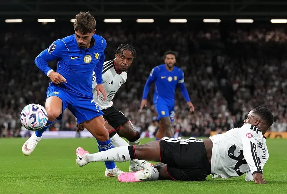 Chelsea player evading tackle during Fulham match Chelsea player evading tackle during Fulham match