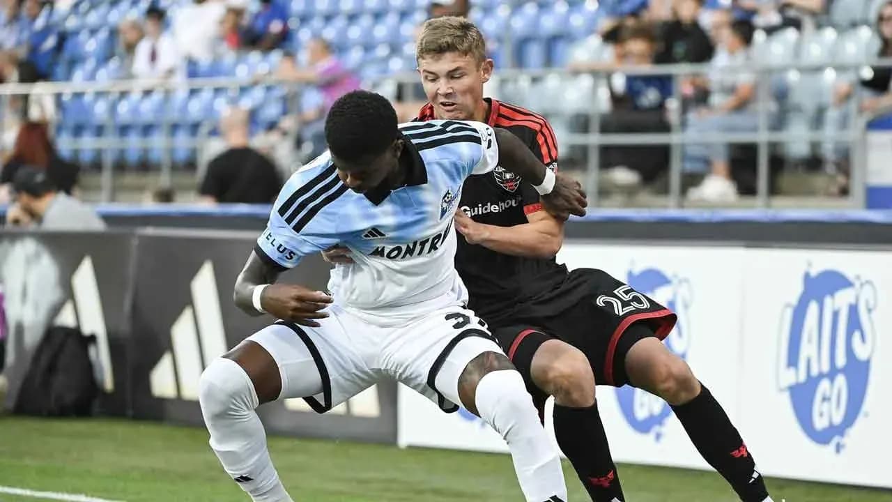 Players battling for the ball during MLS match Players battling for the ball during MLS match