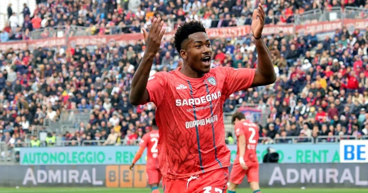 Player celebrating during a match in red jersey Player celebrating during a match in red jersey