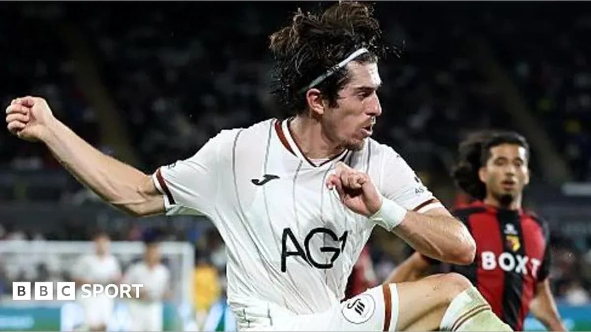 Player in white jersey executing a kick during match Player in white jersey executing a kick during match