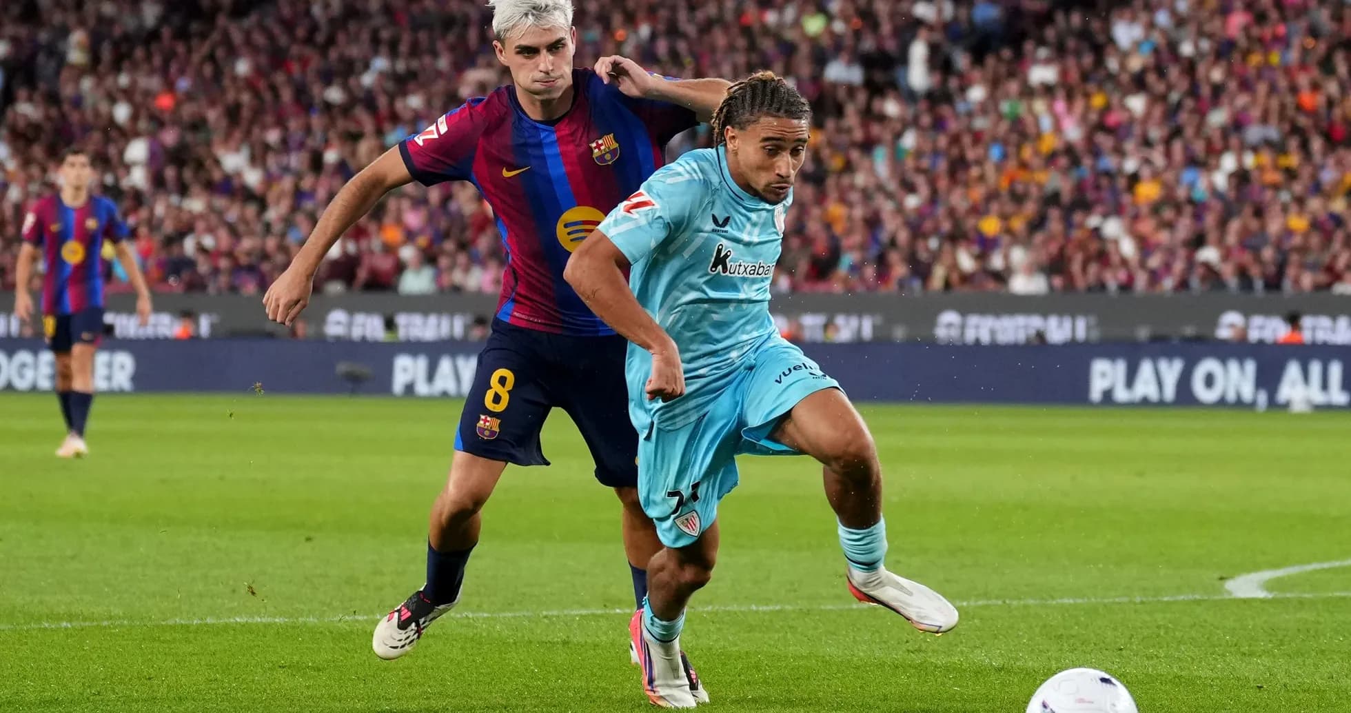 Barcelona player tackling opponent during match Barcelona player tackling opponent during match