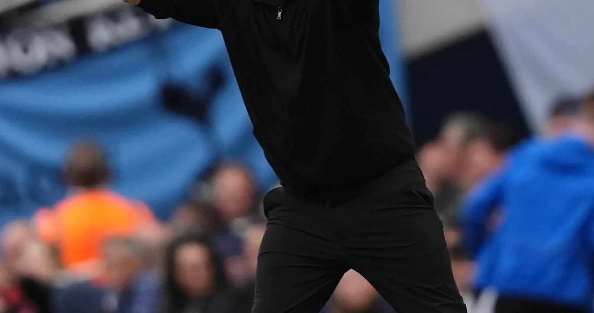 Coach gesturing during a football match on sidelines Coach gesturing during a football match on sidelines