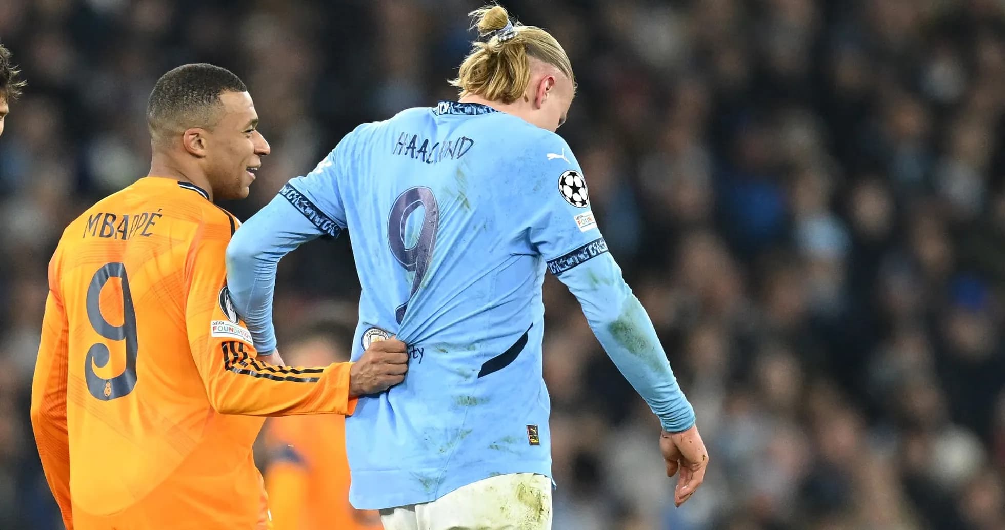 Kylian Mbappé pulling Erling Haaland's jersey during match Kylian Mbappé pulling Erling Haaland's jersey during match