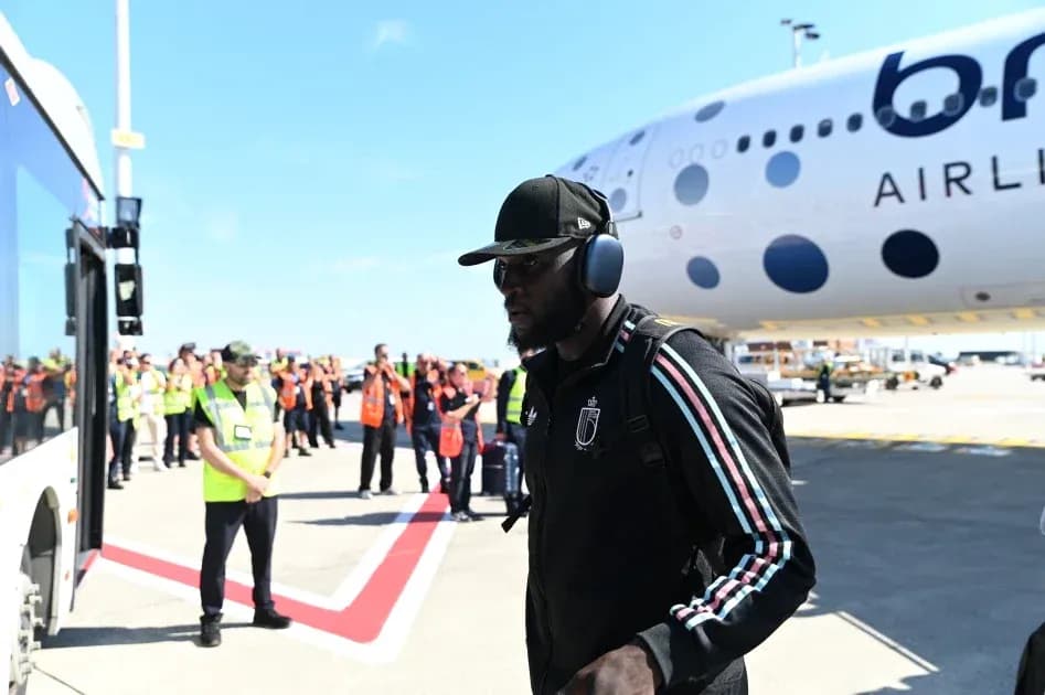 Player arriving at airport near airplane Player arriving at airport near airplane