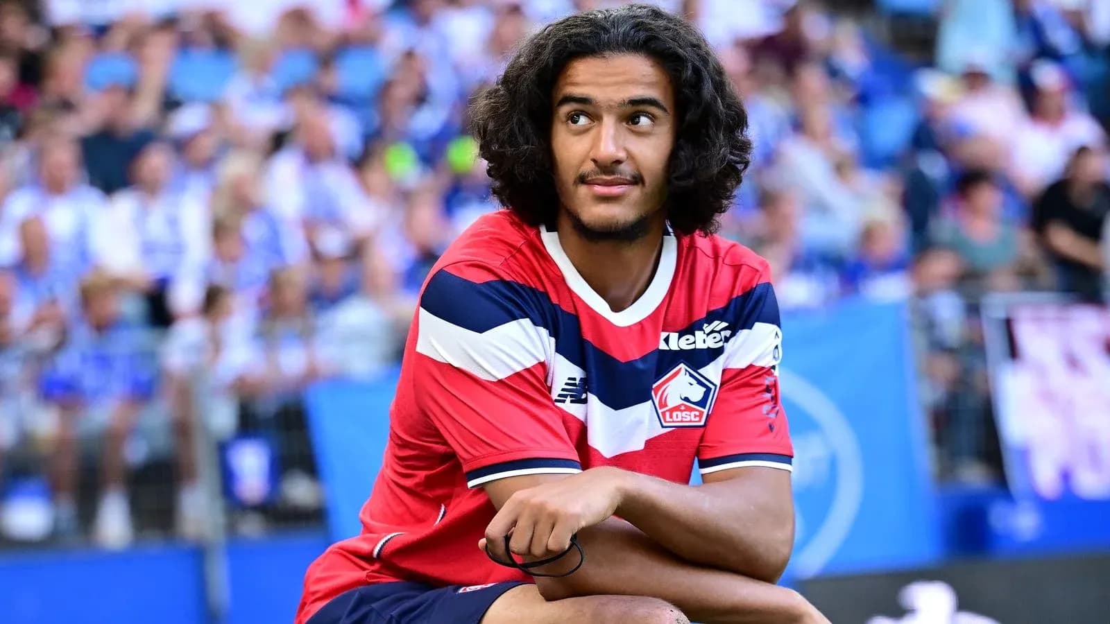 Player sitting on field during match warm-up Player sitting on field during match warm-up