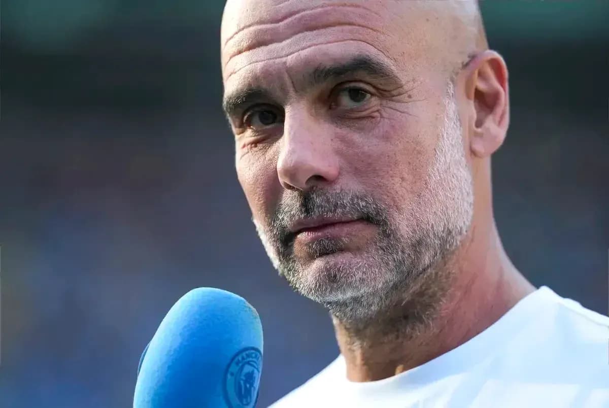 Coach speaking into a microphone during interview Coach speaking into a microphone during interview