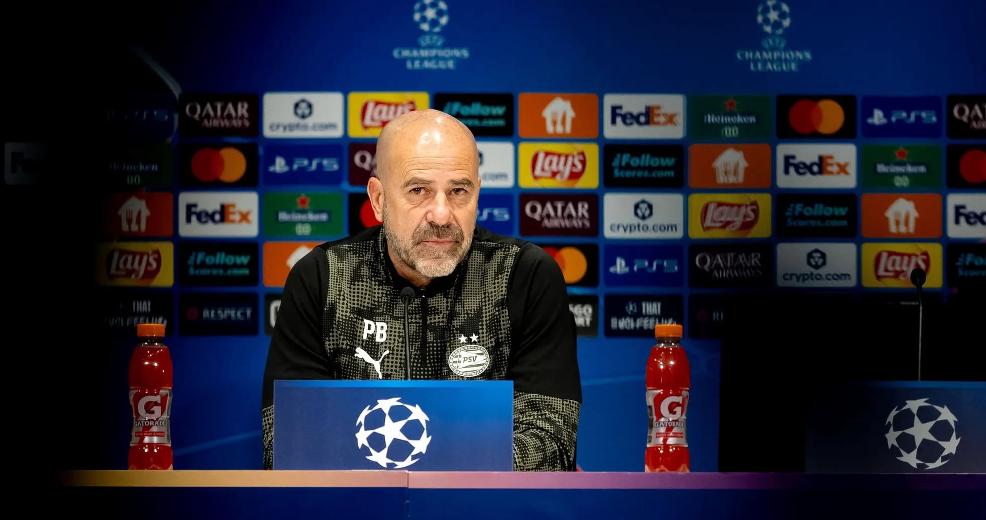Manager at Champions League press conference podium Manager at Champions League press conference podium