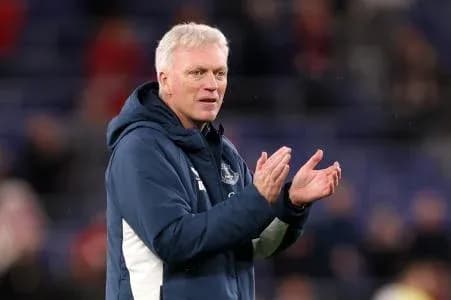 Manager clapping during match on the sideline Manager clapping during match on the sideline