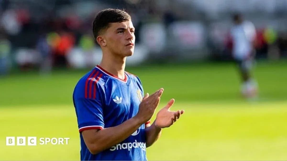 Player applauding fans on the pitch during match Player applauding fans on the pitch during match