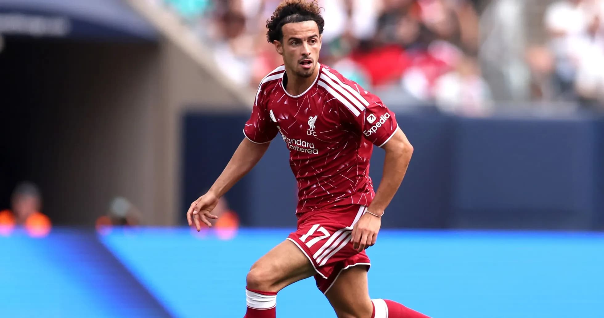 Player in Liverpool kit running during match Player in Liverpool kit running during match