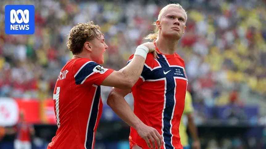 Two Norwegian players celebrating a goal during match Two Norwegian players celebrating a goal during match