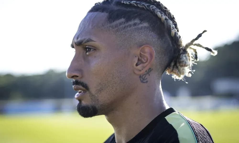 Player with braided hair during training session Player with braided hair during training session