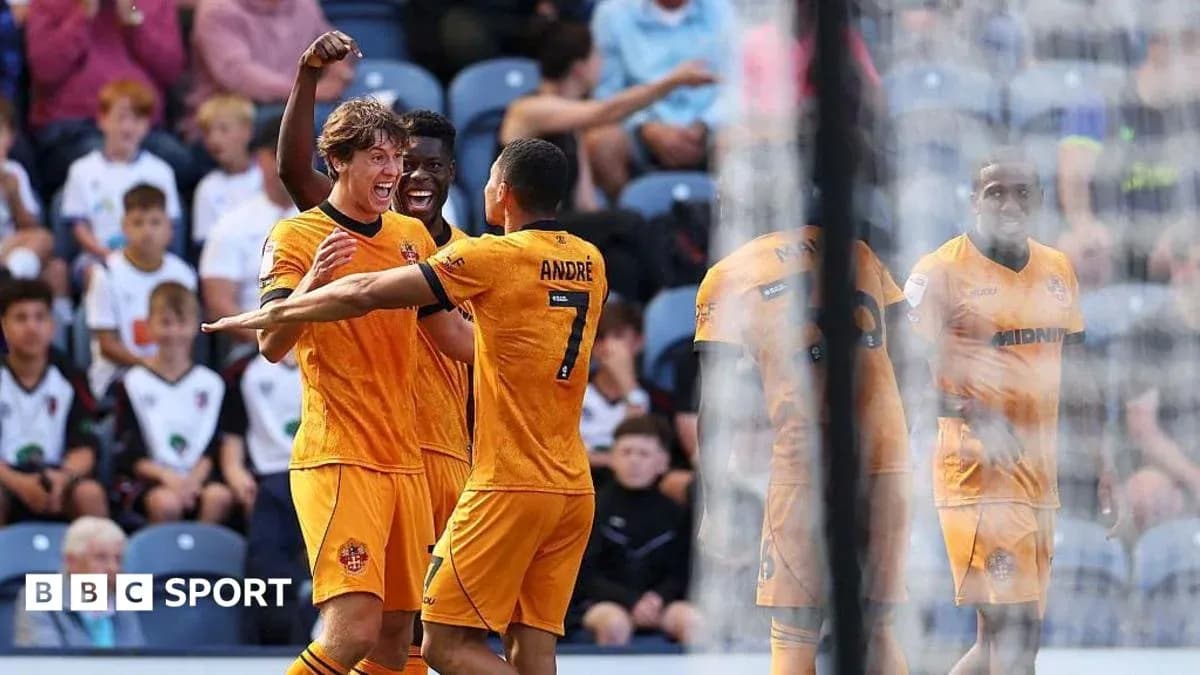 Players celebrating a goal during a match Players celebrating a goal during a match