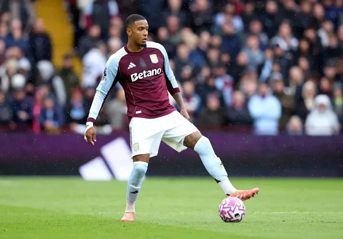 Player in Aston Villa kit preparing to pass ball Player in Aston Villa kit preparing to pass ball