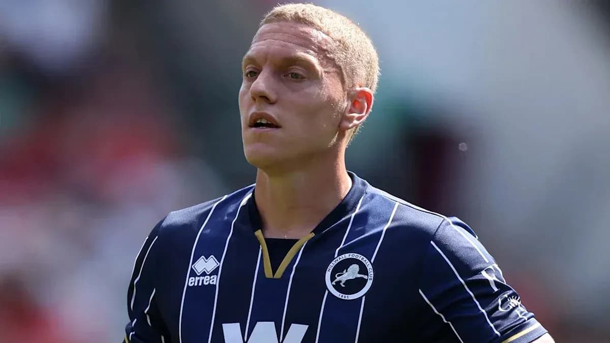 Player wearing Millwall FC jersey on the field Player wearing Millwall FC jersey on the field