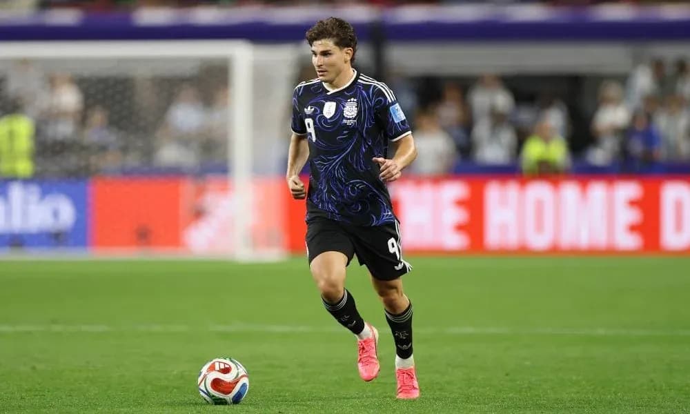 Player in Argentina kit running on the pitch Player in Argentina kit running on the pitch