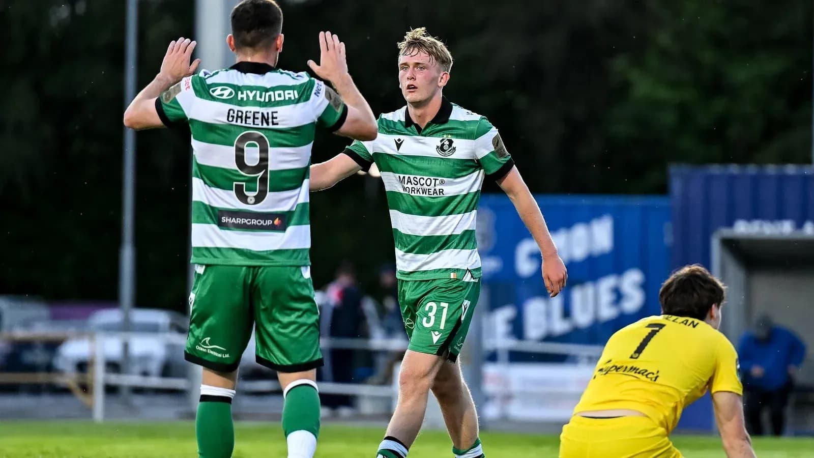 Two players celebrating a goal during a match Two players celebrating a goal during a match