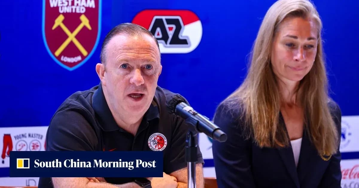 Man speaking at press conference with woman beside him Man speaking at press conference with woman beside him