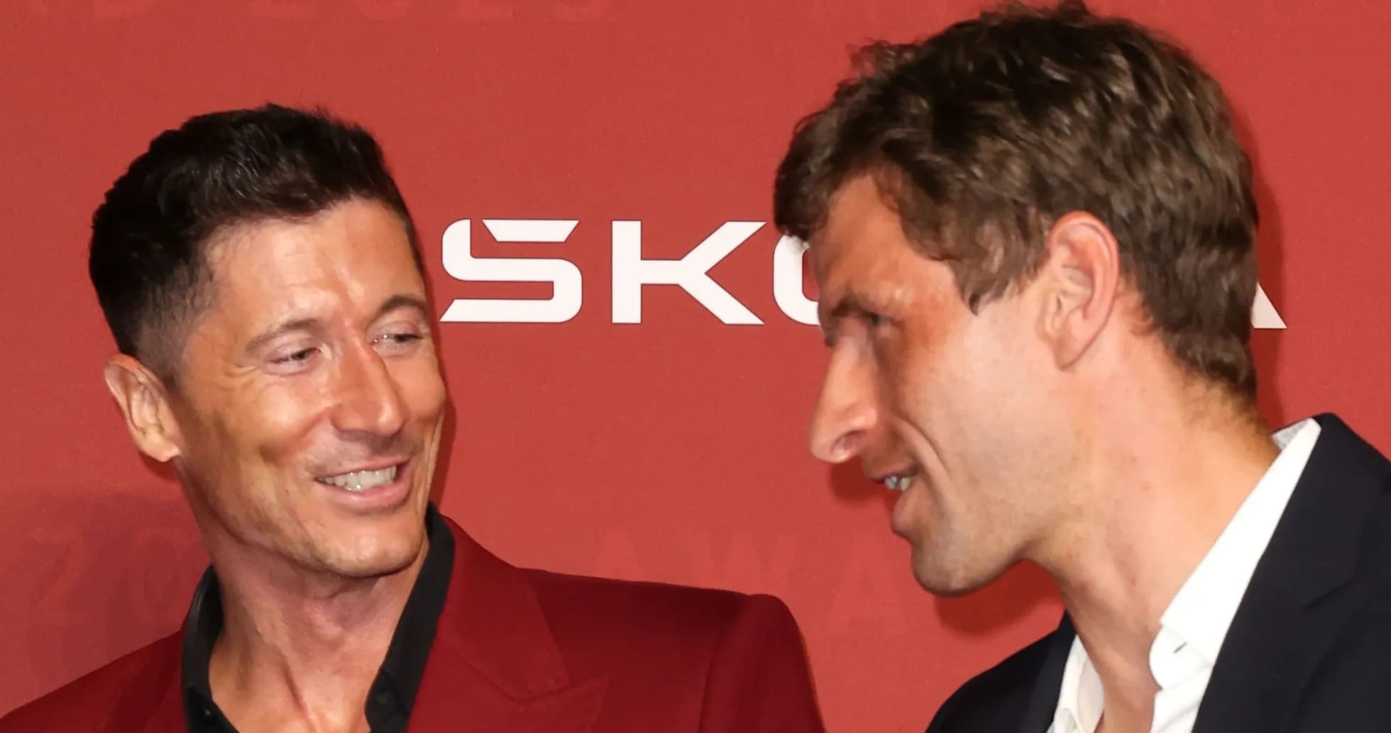 Two players interacting at an awards ceremony Two players interacting at an awards ceremony