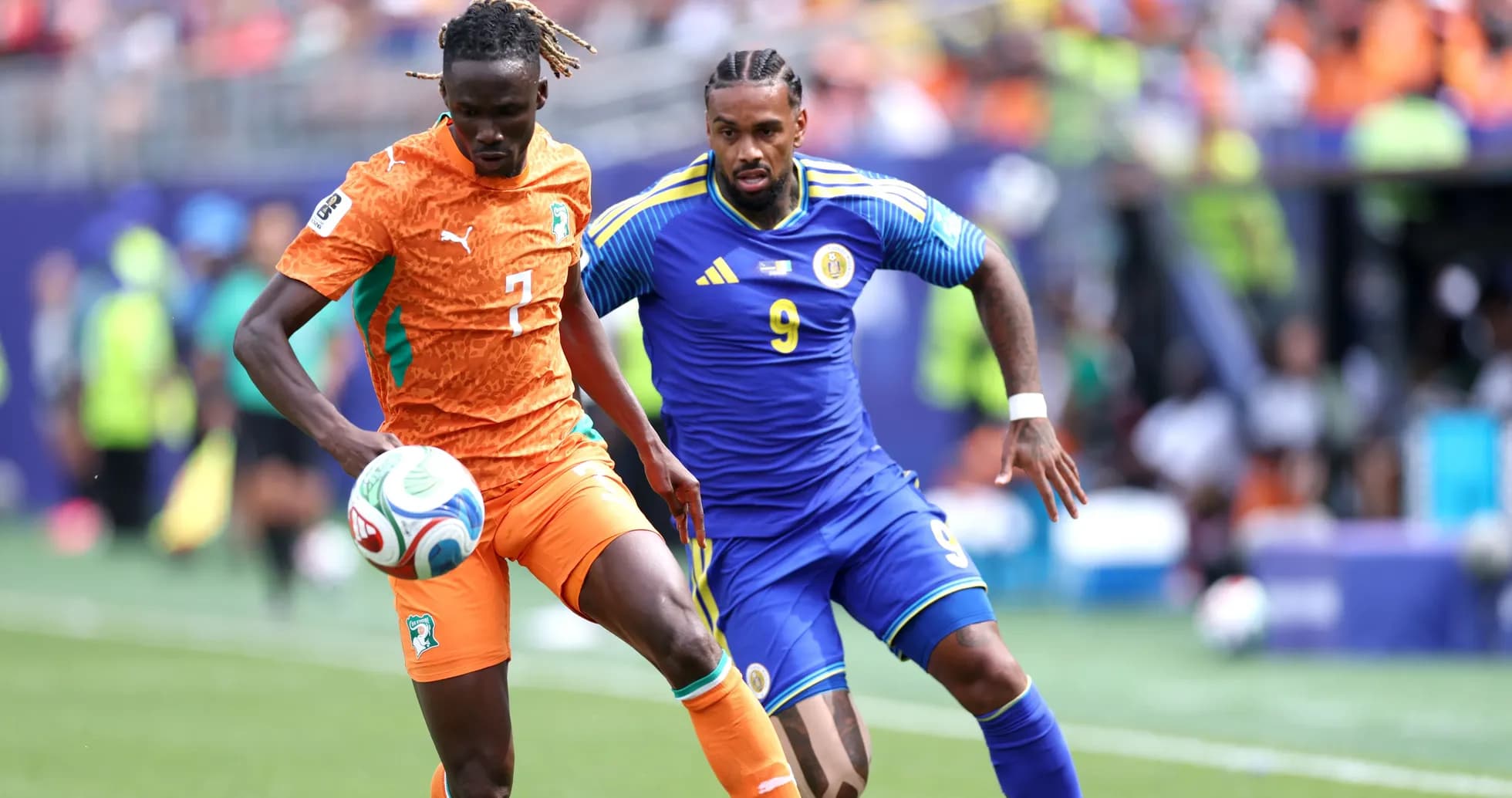Two players contesting the ball during a match Two players contesting the ball during a match