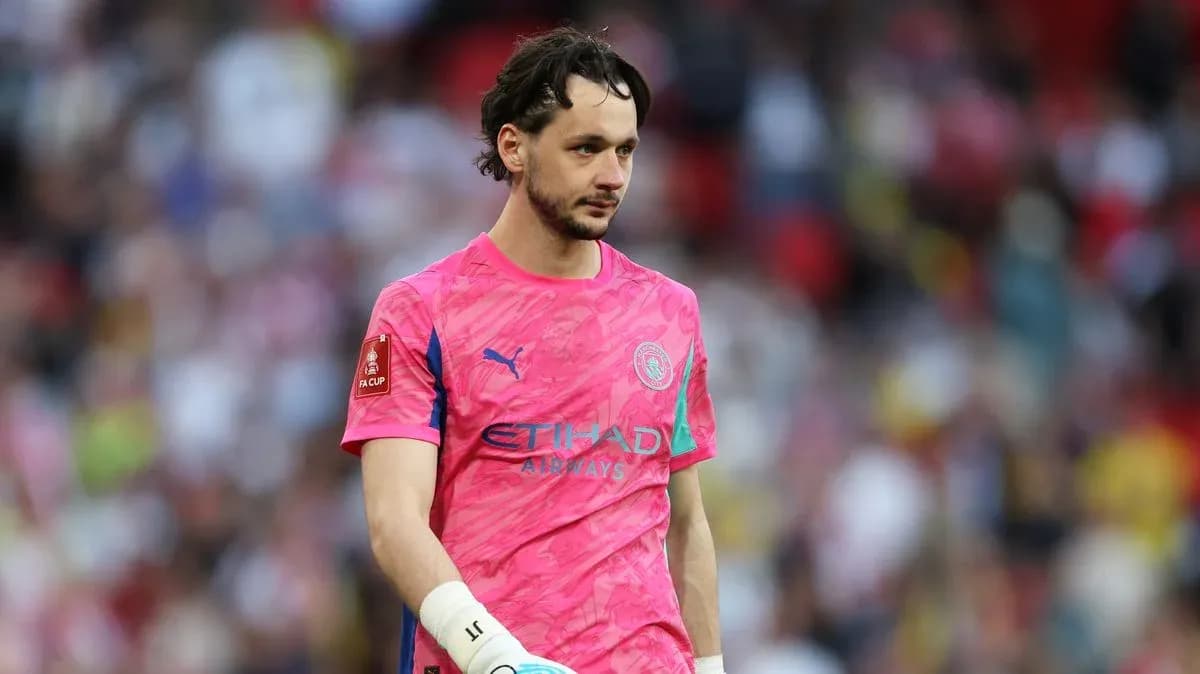 Goalkeeper in pink jersey walking on the pitch Goalkeeper in pink jersey walking on the pitch