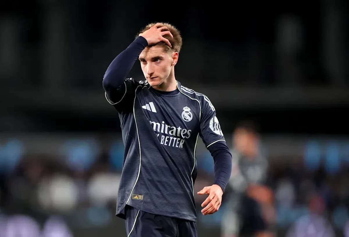 Real Madrid player looking concerned on the pitch Real Madrid player looking concerned on the pitch