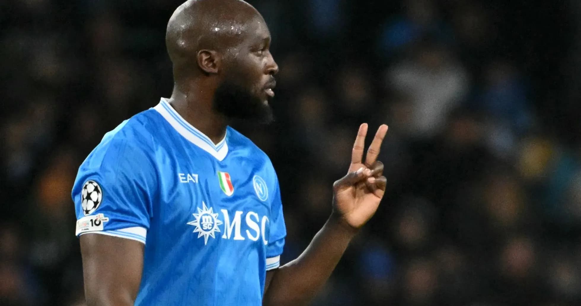 Player gesturing during a match in blue jersey Player gesturing during a match in blue jersey