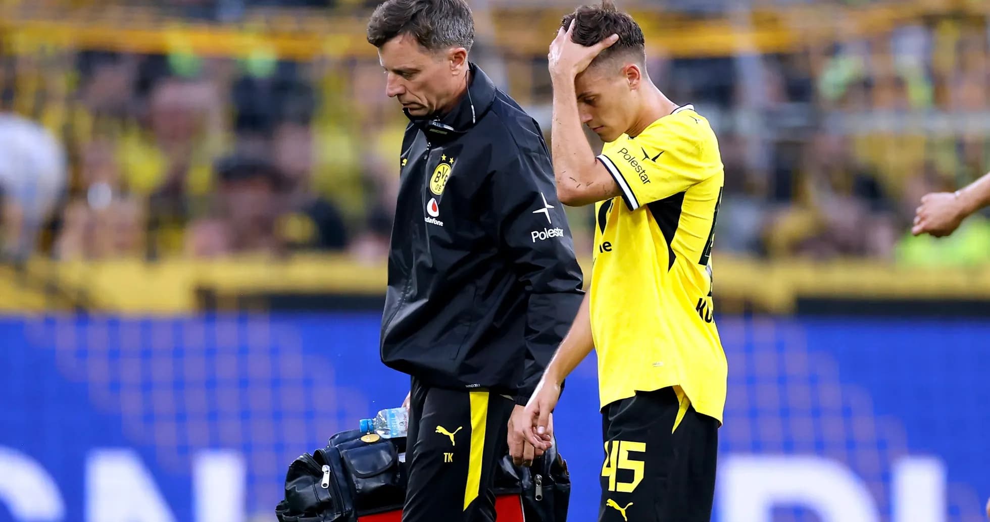 Player receiving medical attention after leaving the field Player receiving medical attention after leaving the field
