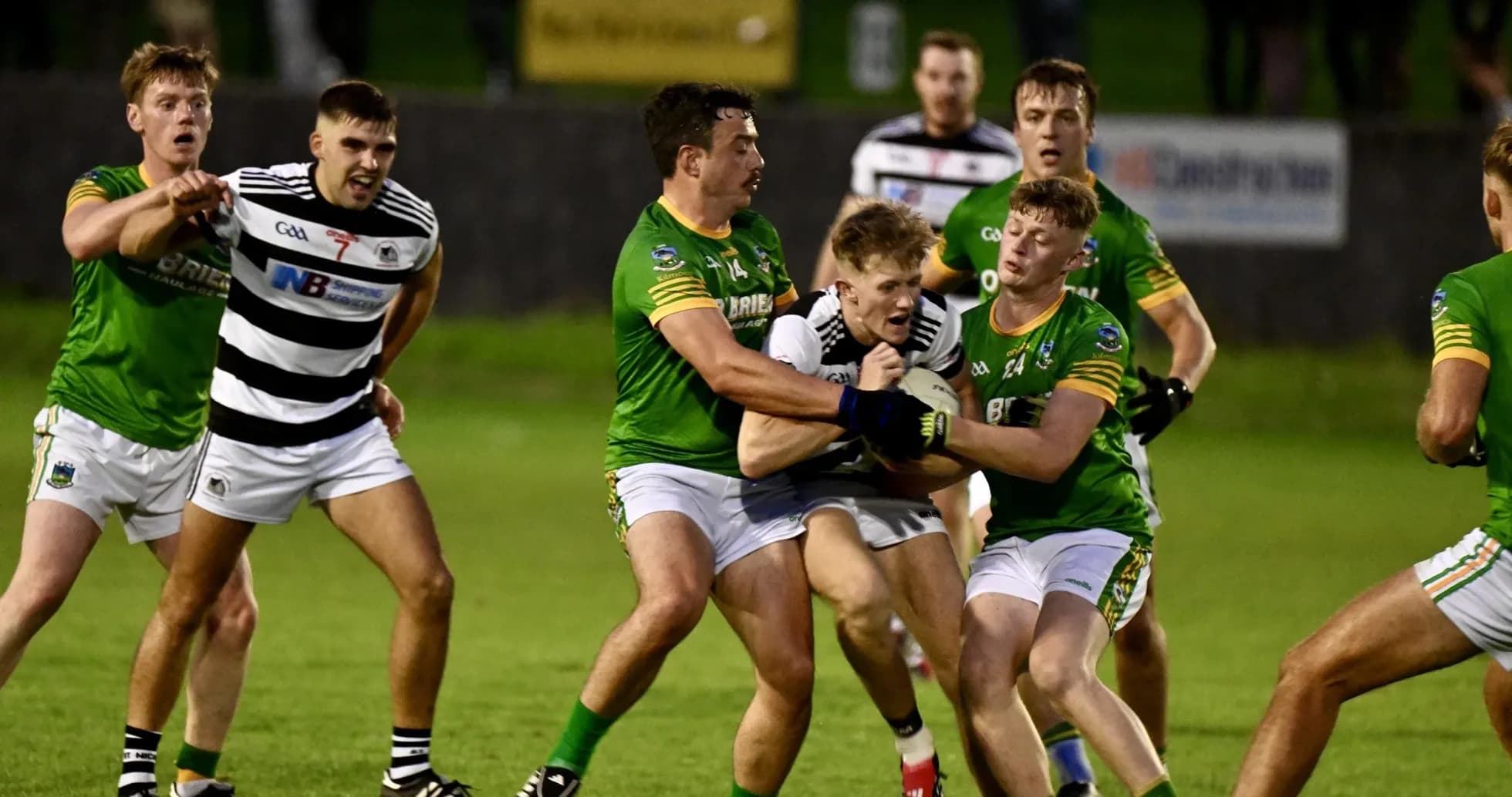 Players competing for possession during a Gaelic football match Players competing for possession during a Gaelic football match