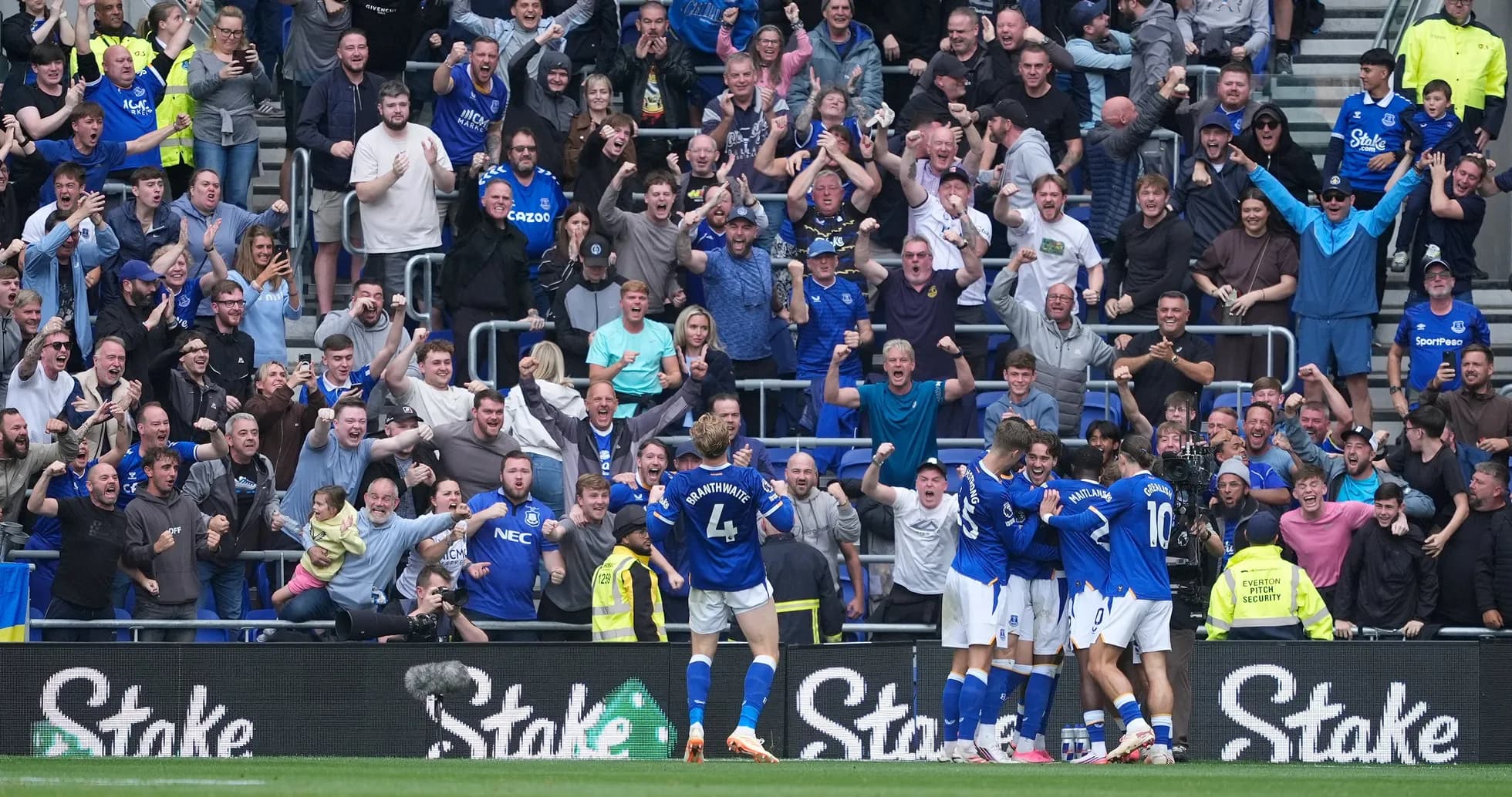 Everton fans celebrating a goal during match Everton fans celebrating a goal during match