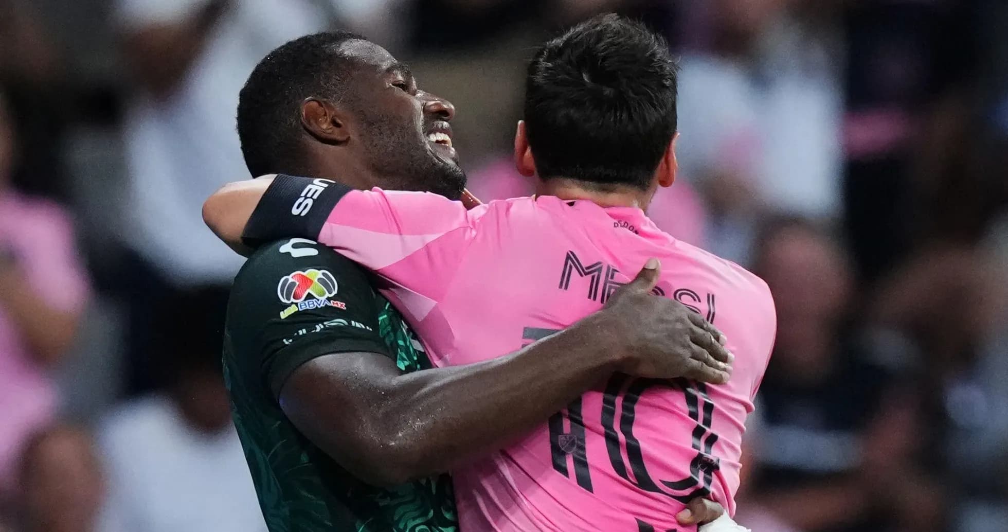 Players celebrating in pink and green jerseys Players celebrating in pink and green jerseys