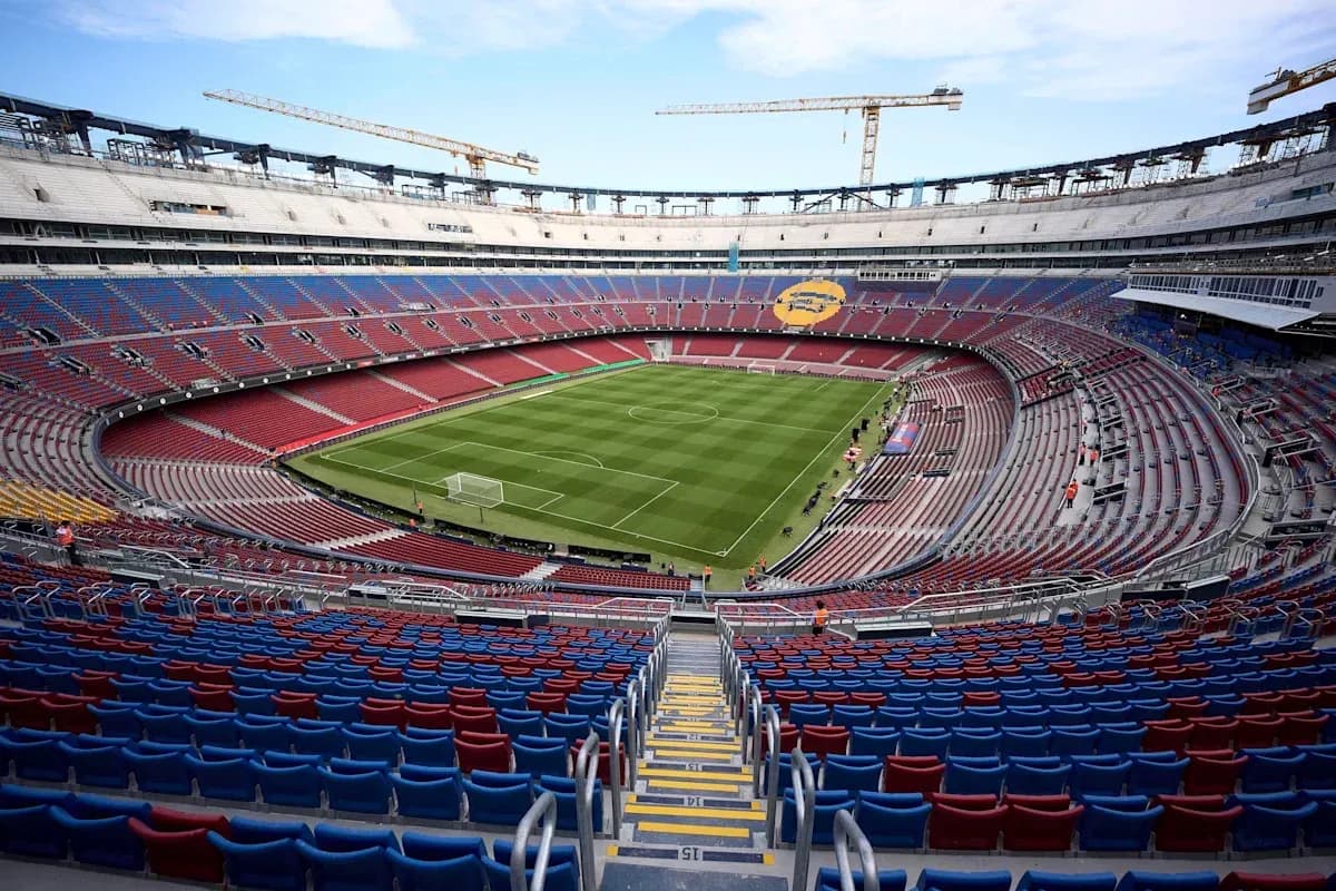 View of empty stadium with football pitch under construction View of empty stadium with football pitch under construction
