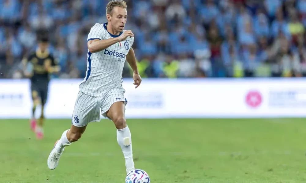Player running with ball during football match Player running with ball during football match