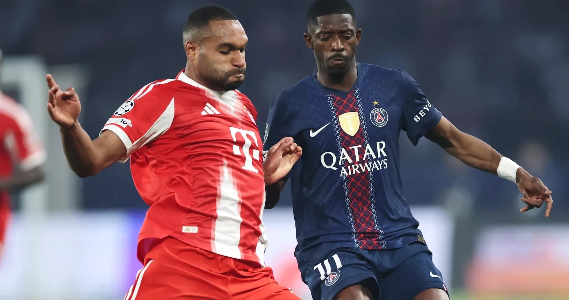 Bayern player and PSG player contesting the ball Bayern player and PSG player contesting the ball
