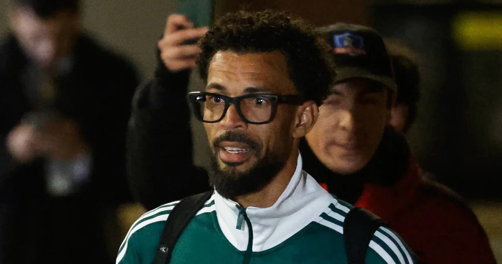 Player in green tracksuit arriving at event Player in green tracksuit arriving at event