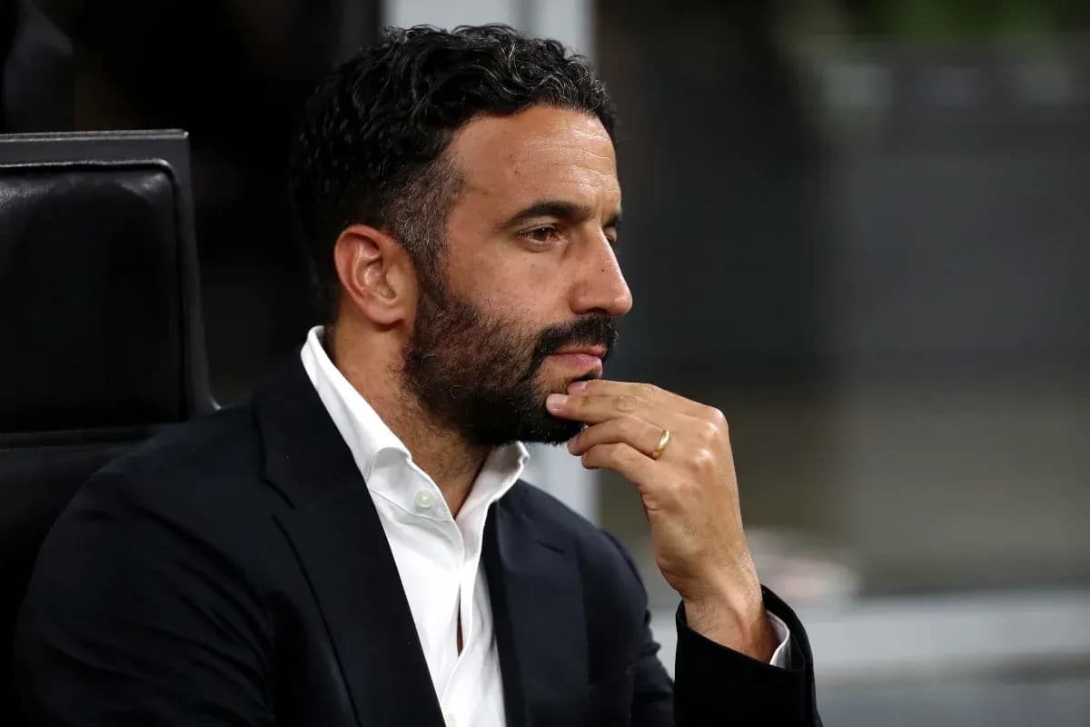 Man in suit with hand on chin, deep in thought Man in suit with hand on chin, deep in thought