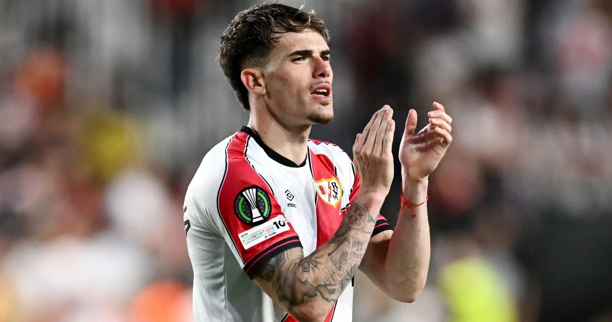 Player applauding fans during a match Player applauding fans during a match