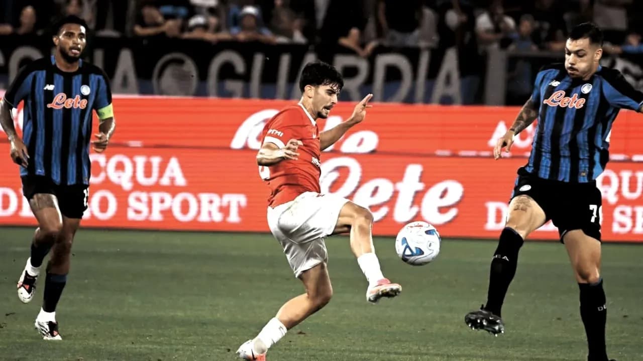 Player attempting to kick the ball during match Player attempting to kick the ball during match