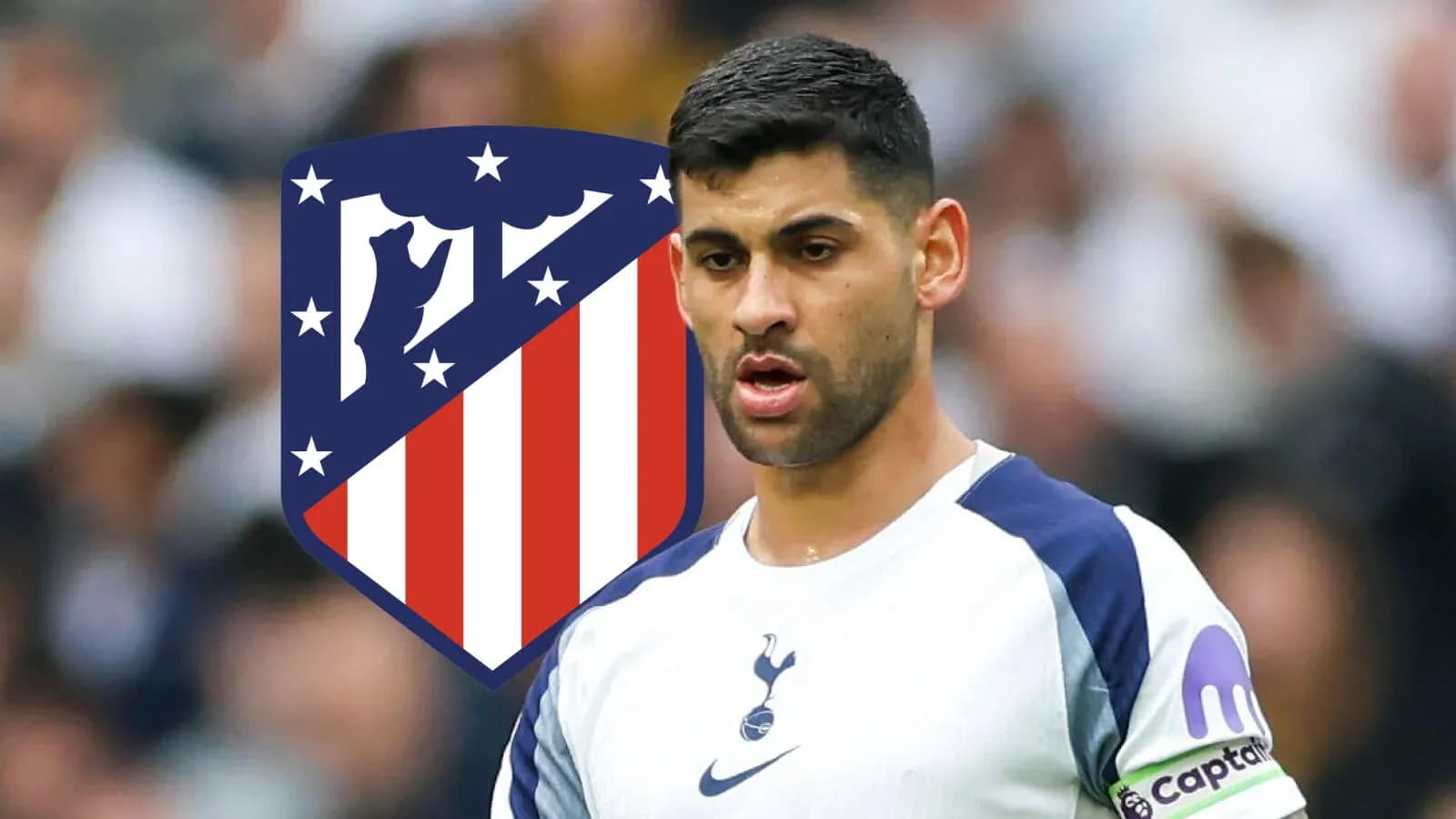 Player in Tottenham kit with Atletico Madrid logo behind Player in Tottenham kit with Atletico Madrid logo behind