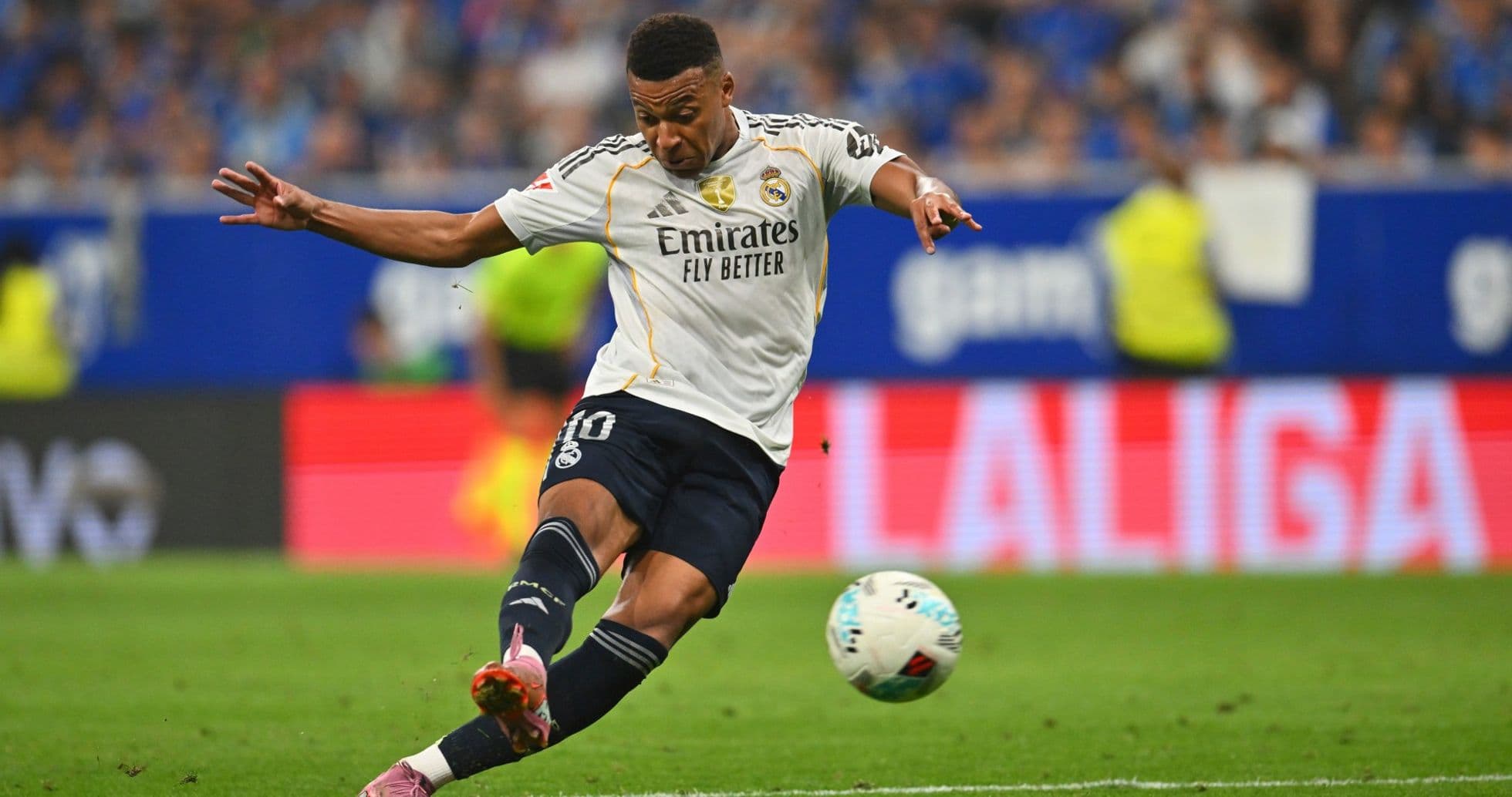 Player kicking the ball during Real Madrid match Player kicking the ball during Real Madrid match