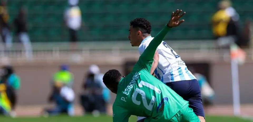 Pyramids FC player evading GOR Mahia goalkeeper Pyramids FC player evading GOR Mahia goalkeeper
